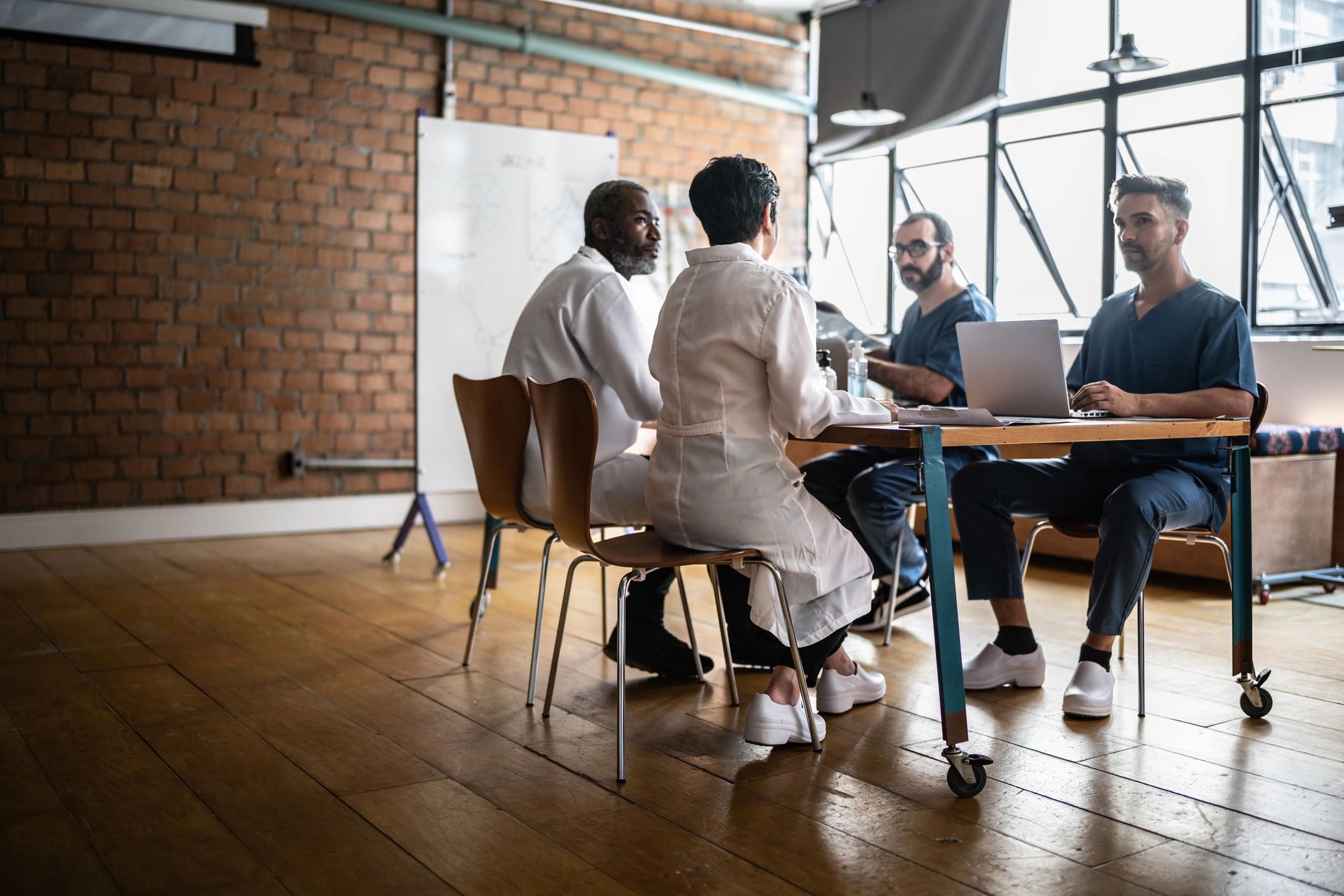 Academic research team in discussion during a meeting
