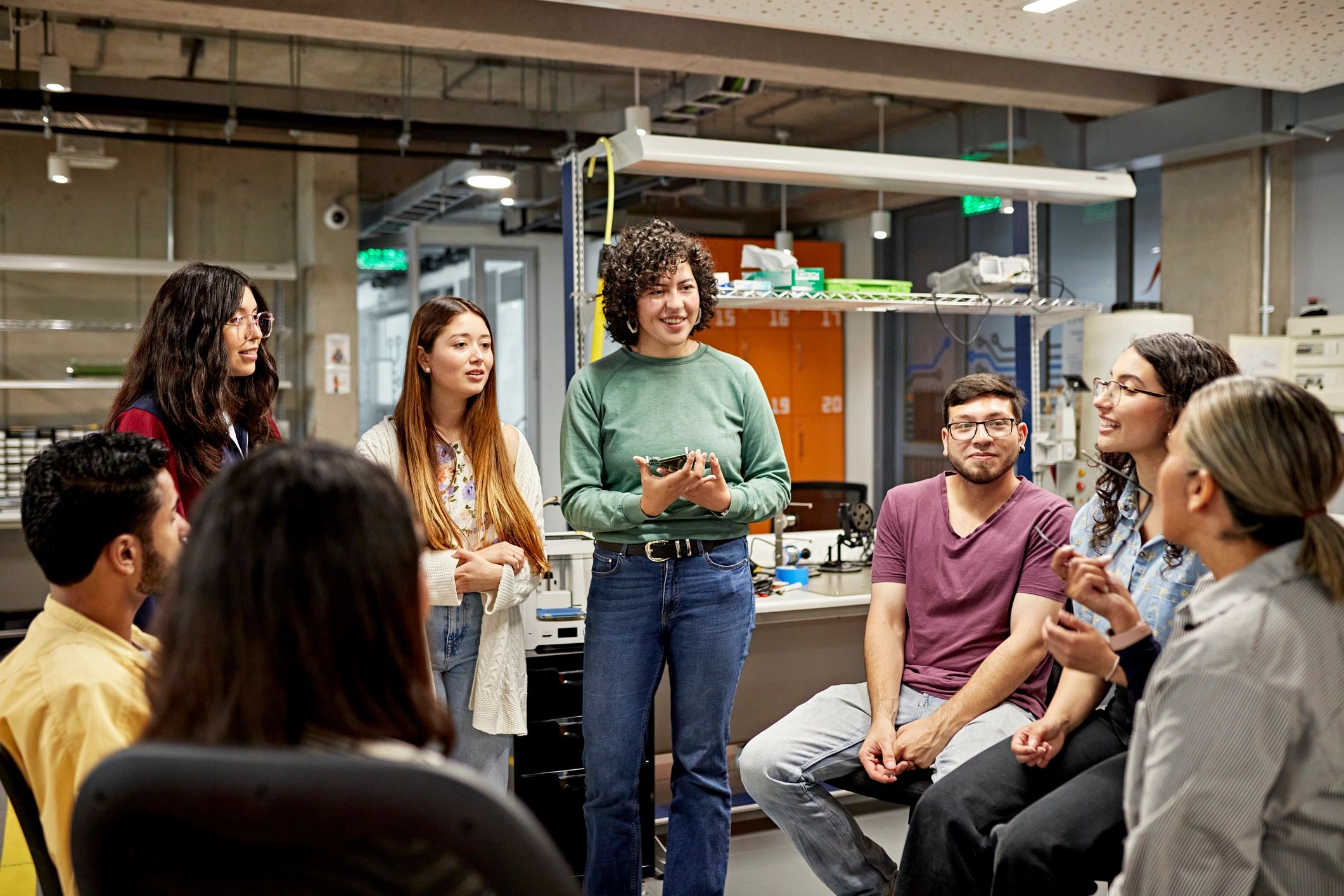 Academic colleagues in a laboratory discussing research